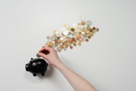 coins to piggy bank Apr23 blog.jpg